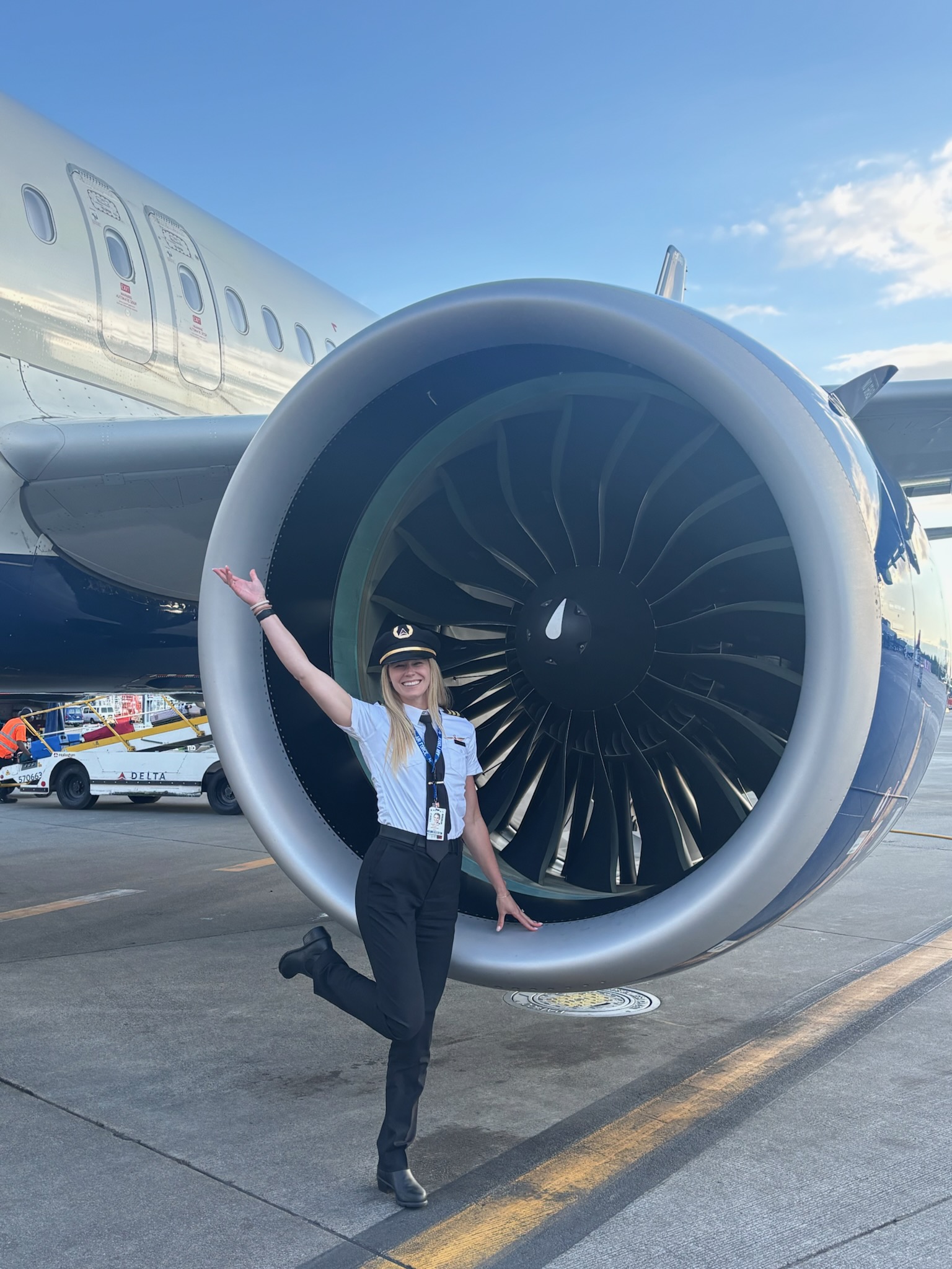 Coast Aero Ventures graduate in front of a Delta jet engine